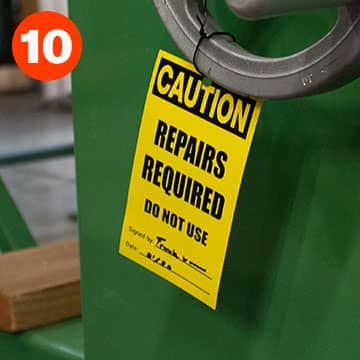 Caution repairs required tag hanging on equipment