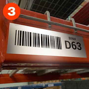 Reflective bin location label on warehouse racking