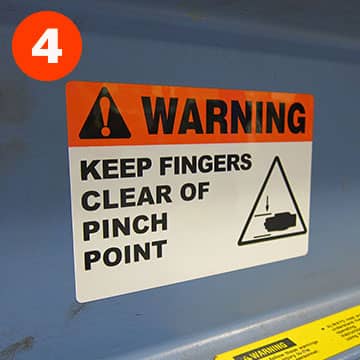 Pre-printed warning header label about a pinch point
