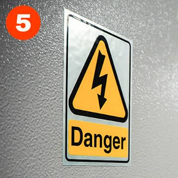 Danger high voltage label applied to equipment
